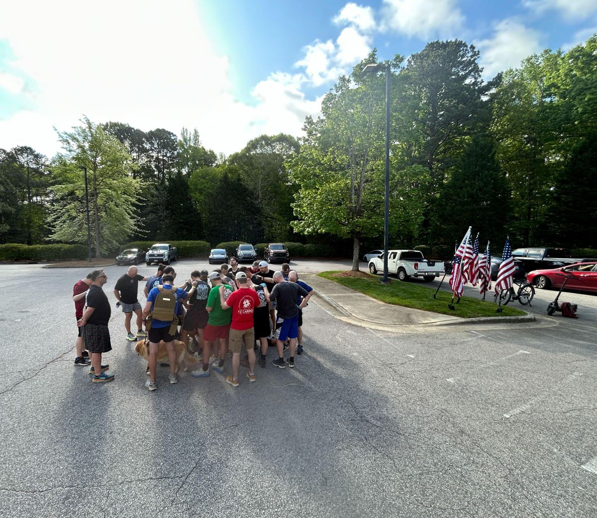 F3 men gathered in a circle with hands on shoulders